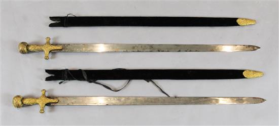 A near pair of Indian sword tulwars, late 19th century, L 81cm (blade)